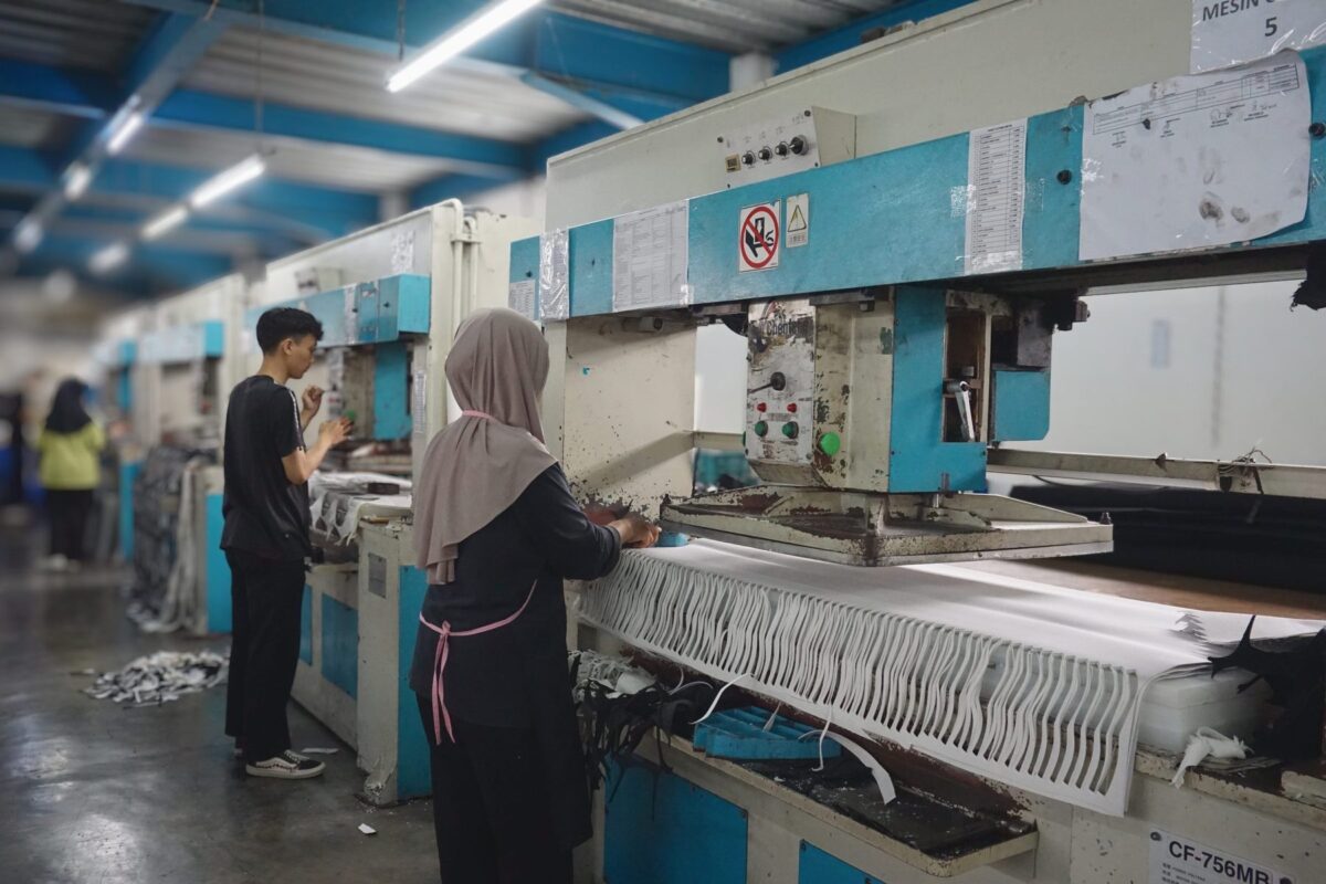 Cutting the materials for Ventela sneakers at the PT Sinar Runnerindo factory