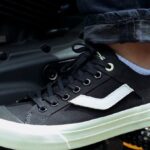 Black Ventela All Is Well on a motorcycle footpeg